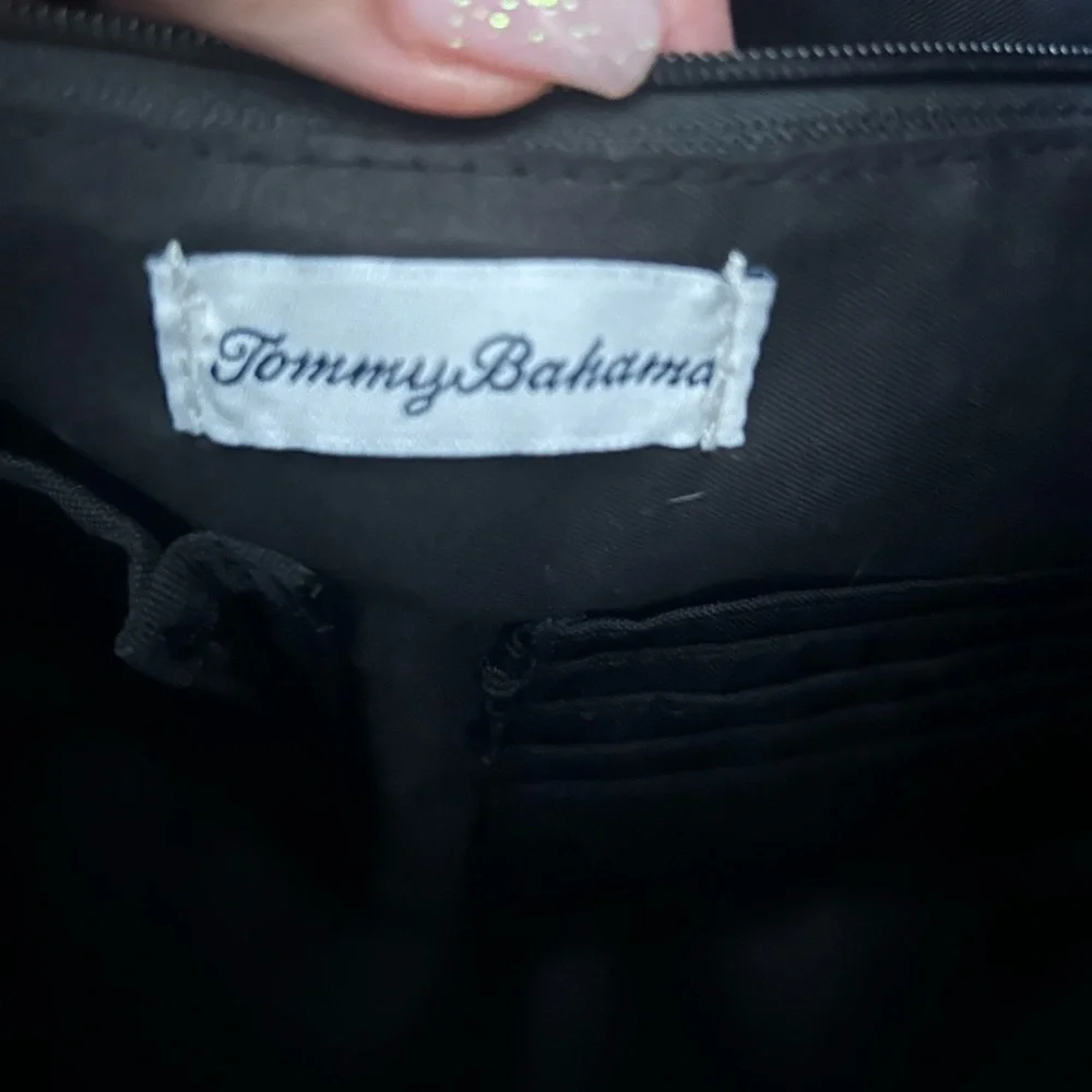 Tommy Bahama black travel duffle bag with hand and shoulder straps